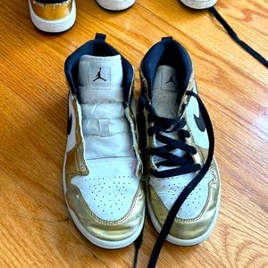White and gold Air Force 1s